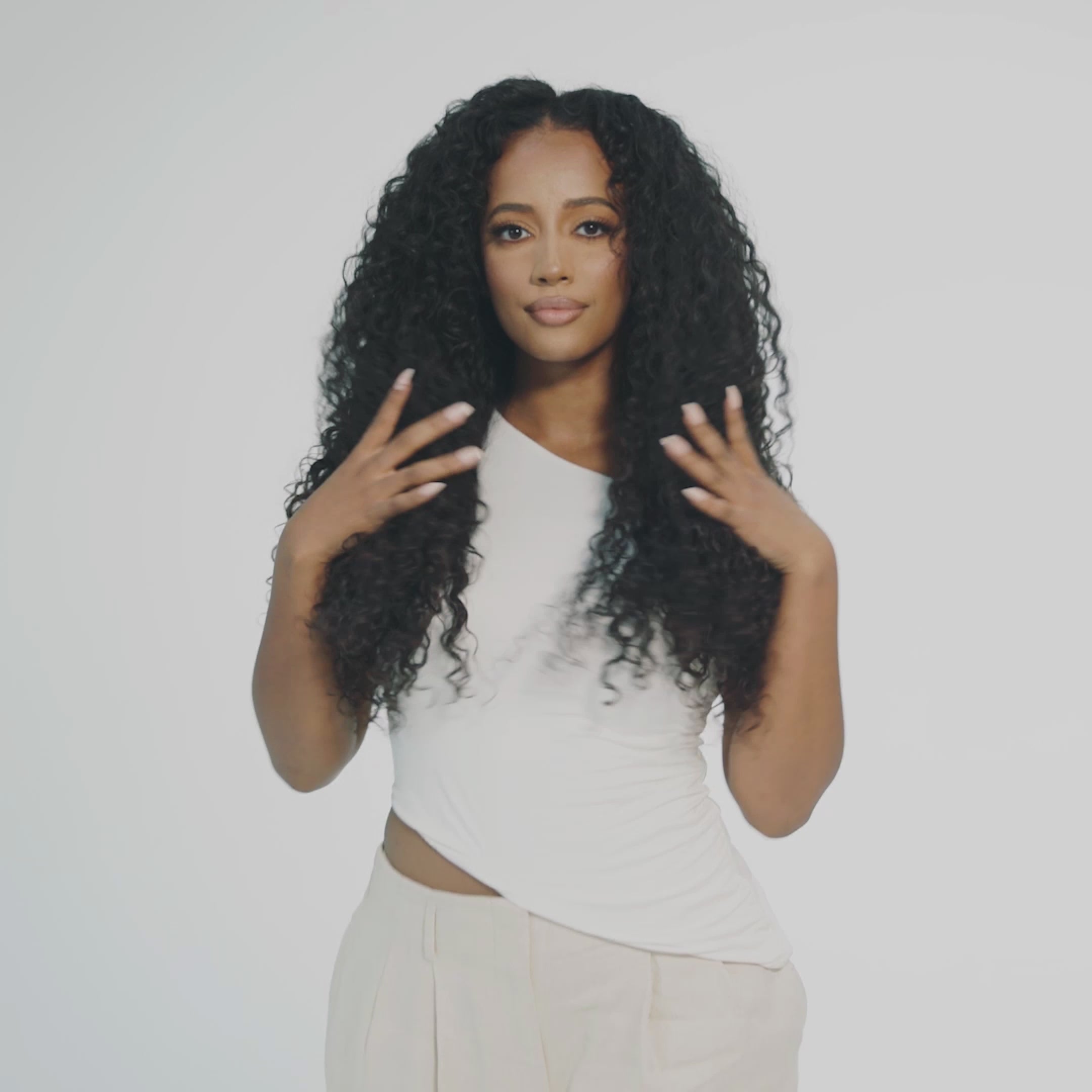 &quot;Model wearing a full big curly wig that look extremely natural. This wig is designed for alopecia, hair loss, fashion, or religious reasons. The wig features voluminous, bouncy curls and is showcased against a white studio background. The model has a natural, soft glam makeup look.